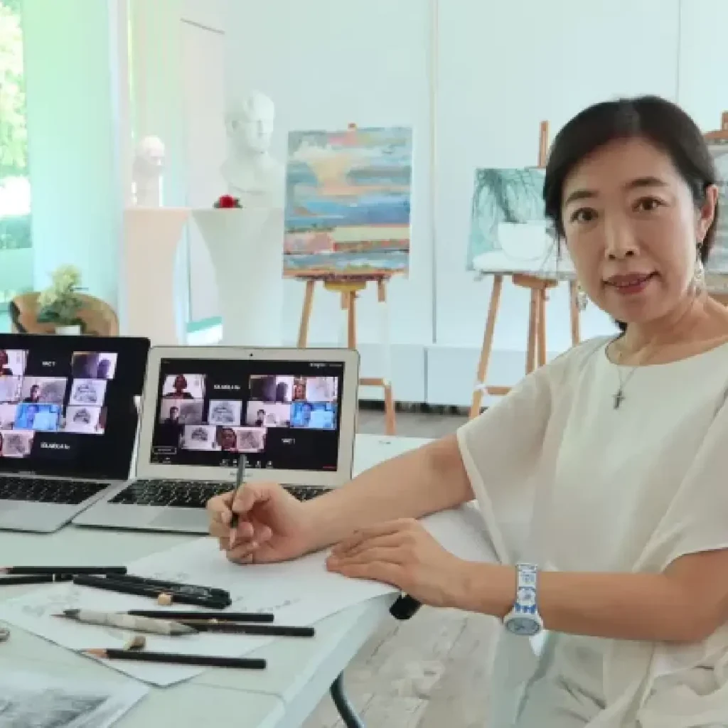A participant sketching live on screen during a Drawing Online Zoom Class, with an instructor demonstrating techniques in the corner