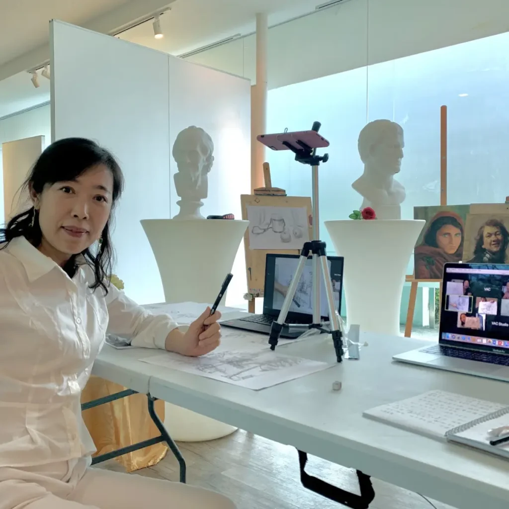 Artist participating in a Zoom live drawing class, learning sketching techniques