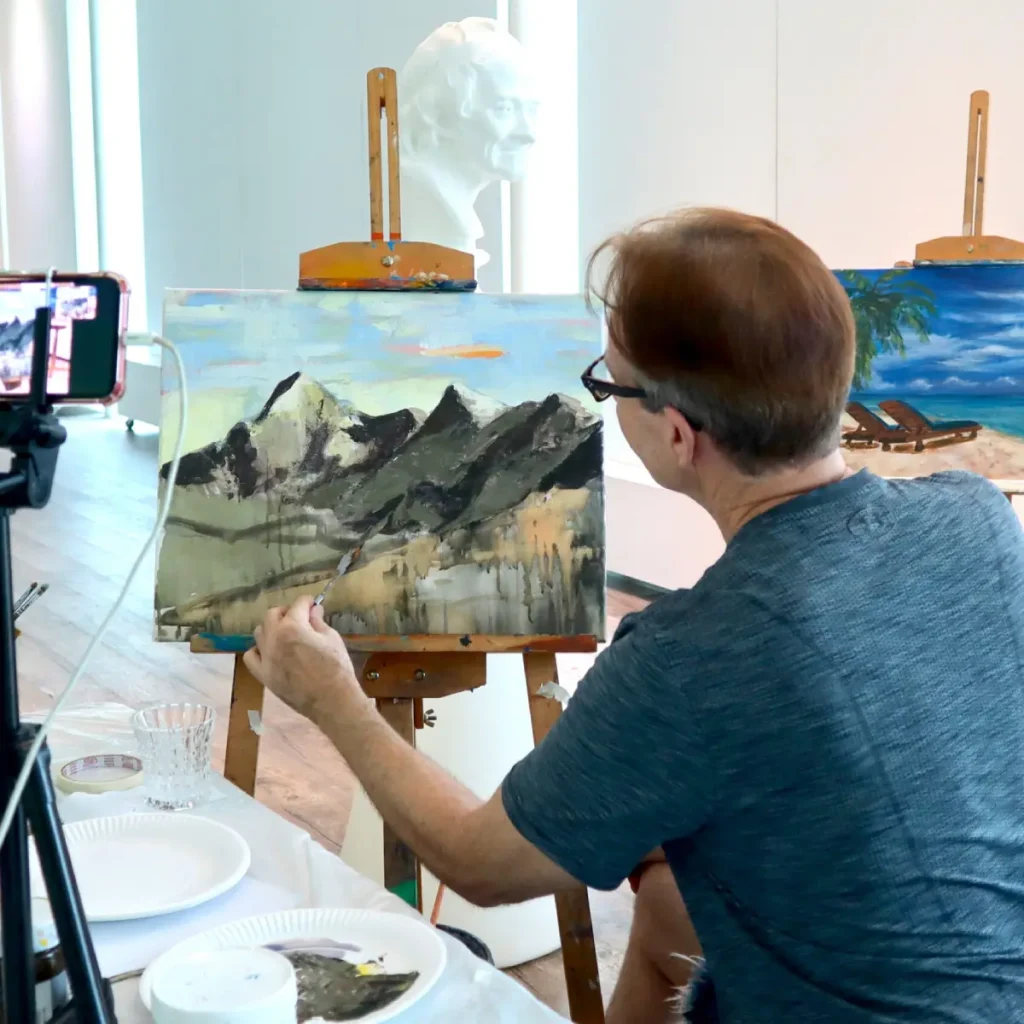 Instructor guiding students in a live Zoom acrylic painting class