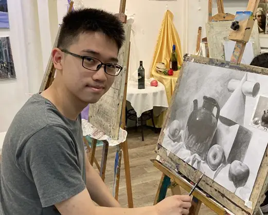 Kid doing a Still Life Piece at visual arts centre