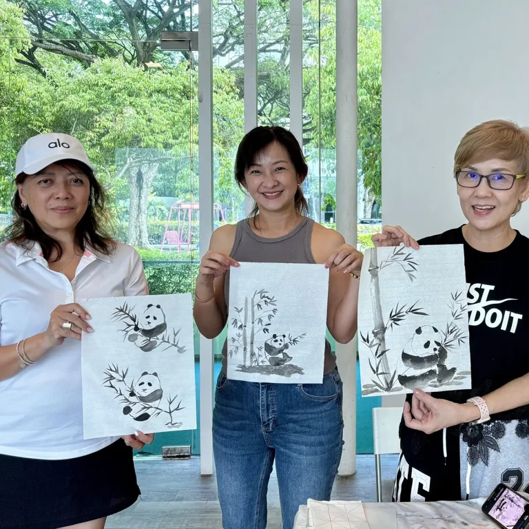 Student practicing brush techniques in a Professional Chinese Ink Painting class