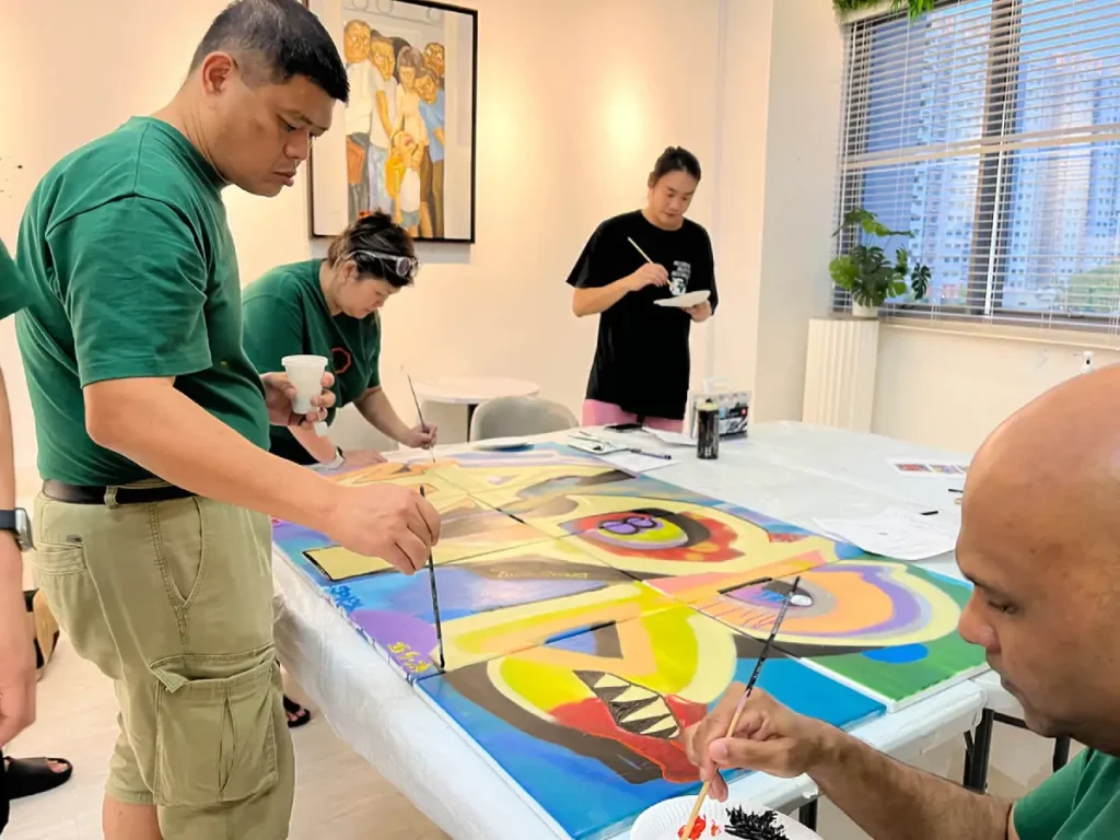 participants-doing-acrylic-painting-on-graffiti-spray-painting-on-mural