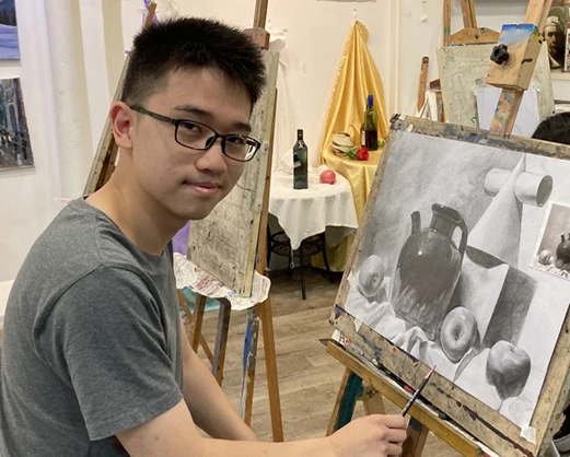 Kid doing a Still Life Piece at visual arts centre