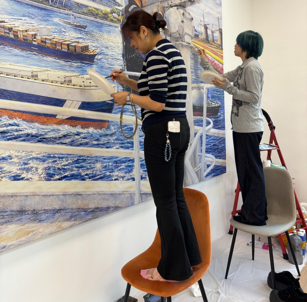 Custom made company mural Visual Arts Centre.jpeg installing setup