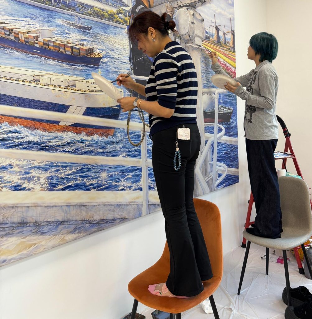 Custom made company mural Visual Arts Centre.jpeg installing setup