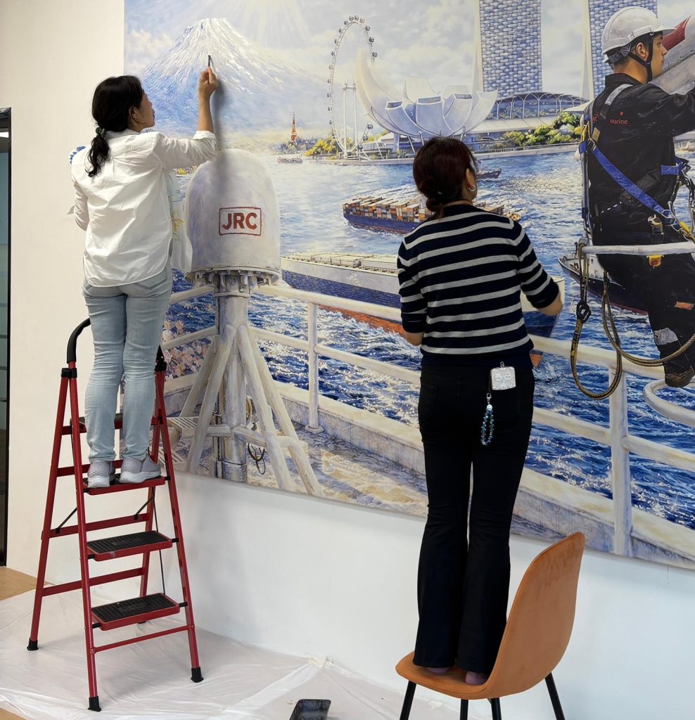 Custom made company mural Visual Arts Centre.jpeg installing setup