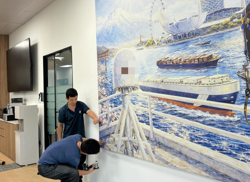 Custom made company mural Visual Arts Centre.jpeg installing setup